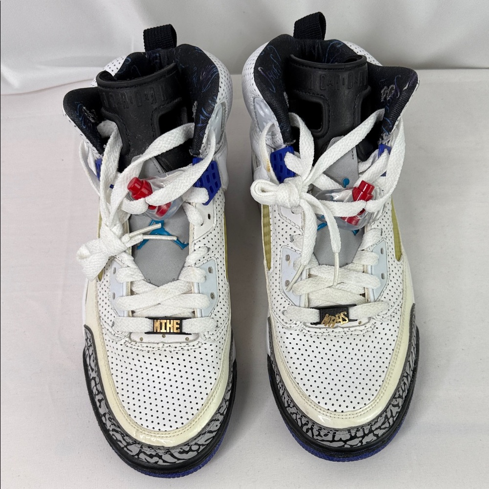 Nike White Sneakers with Black, Blue and Red Accents